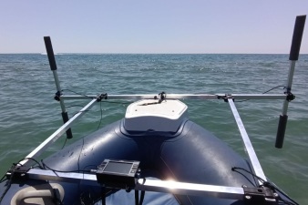 Two-sensor basic gradiometer scanner on the boat in the sea